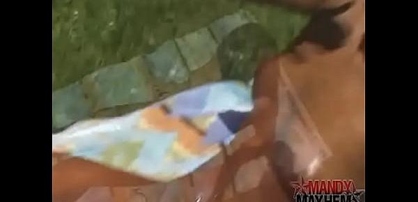  Mandy Mayhem covering her body in oil outside while naked!